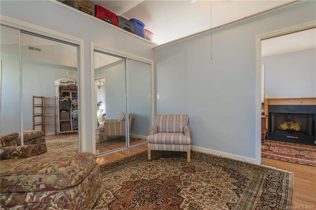 5975 Hunting Country Road Tryon, NC 28782 - Photo 27 of 47 a living room with furniture and a fireplace