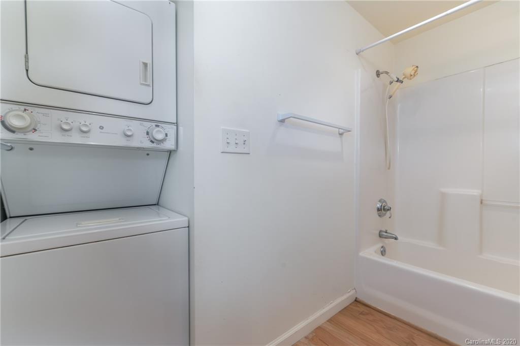 5975 Hunting Country Road Tryon, NC 28782 - Photo 28 of 47 a bathroom with a bathtub and a shower
