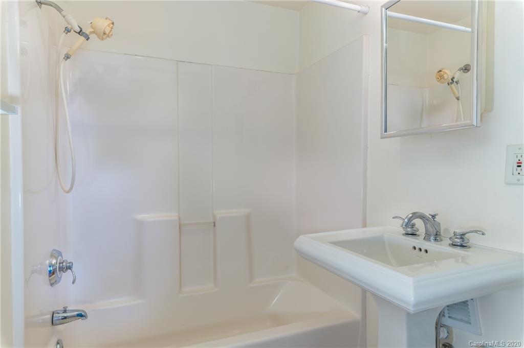5975 Hunting Country Road Tryon, NC 28782 - Photo 29 of 47 a bathroom with a sink and mirror