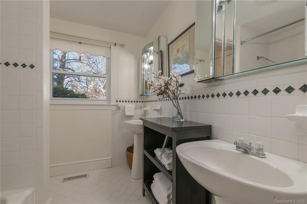5975 Hunting Country Road Tryon, NC 28782 - Photo 42 of 47 a bathroom with a sink and a mirror