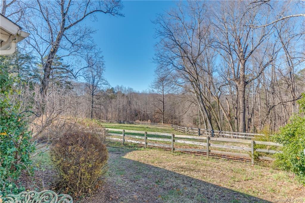 5975 Hunting Country Road Tryon, NC 28782 - Photo 43 of 47 a view of a yard with large trees
