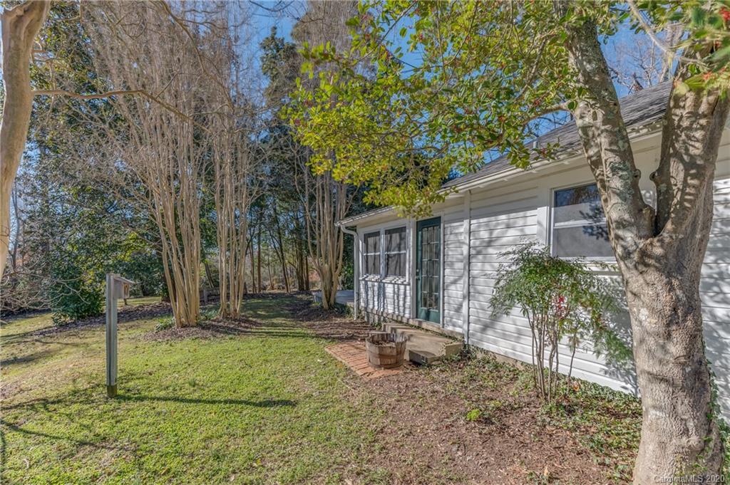 5975 Hunting Country Road Tryon, NC 28782 - Photo 44 of 47 a front view of a house with garden