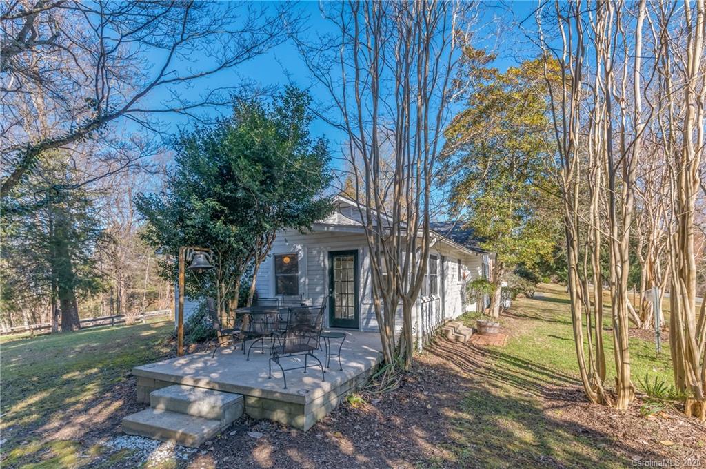 5975 Hunting Country Road Tryon, NC 28782 - Photo 45 of 47 a front view of a house with a yard