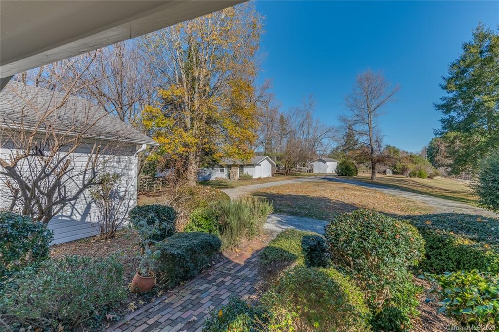 5975 Hunting Country Road Tryon, NC 28782 - Photo 7 of 47 a view of a yard with flower plants