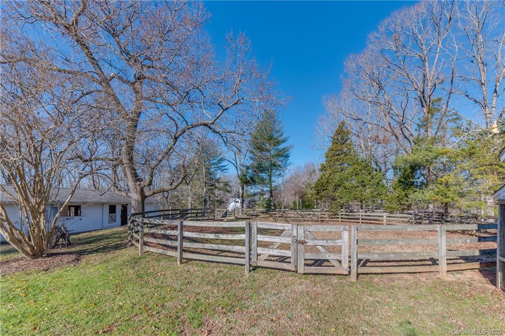 5975 Hunting Country Road Tryon, NC 28782 - Photo 8 of 47 a backyard of a house with lots of green space