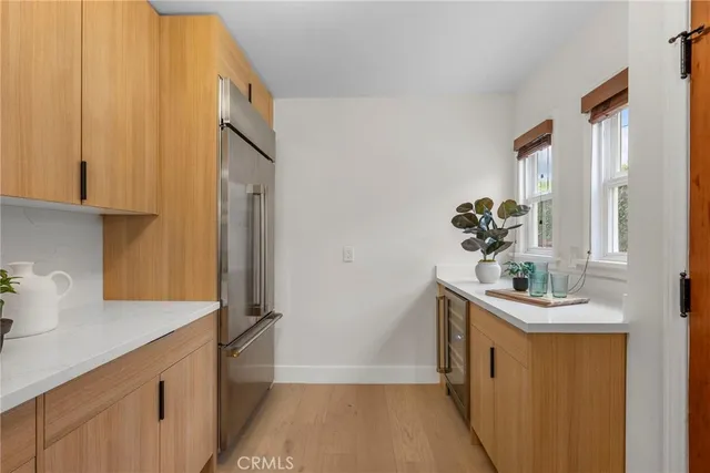 a kitchen with a sink and refrigerator