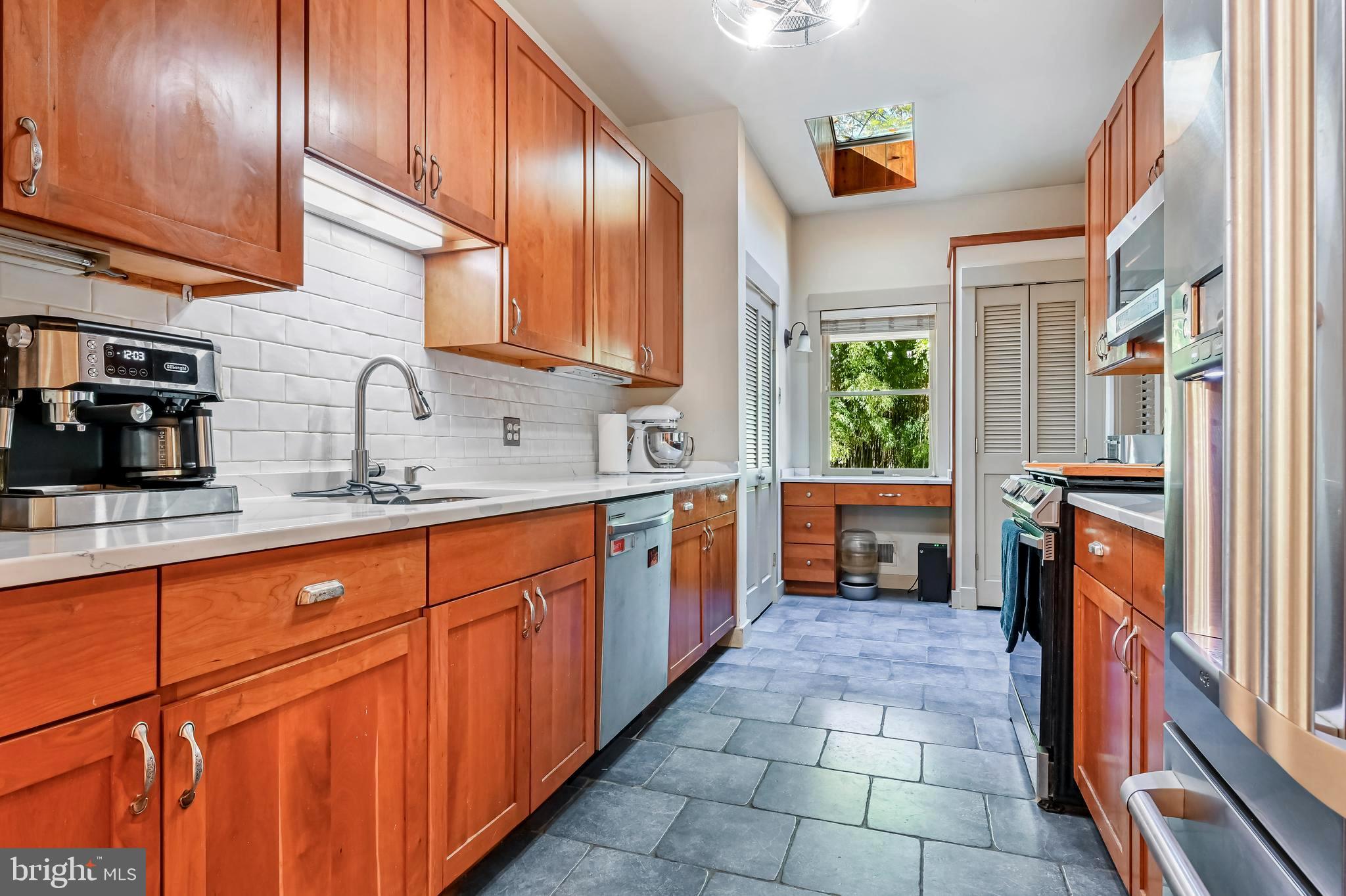 4921 Idlewilde Road Shady Side, MD 20764 - Photo 25 of 58 Updated Galley-Style Kitchen . Ample Wood Cabinets