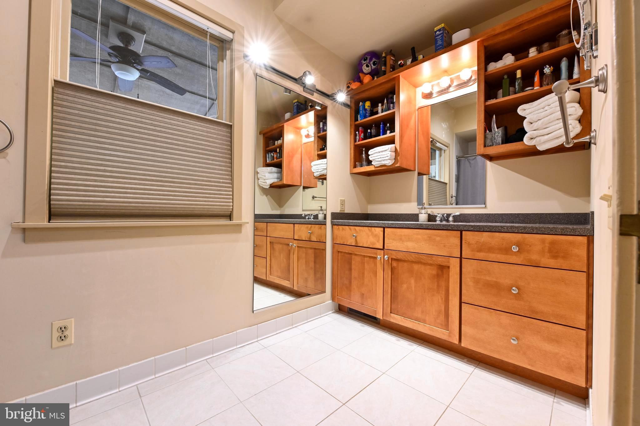 4921 Idlewilde Road Shady Side, MD 20764 - Photo 40 of 58 Custom Granite-Topped Vanity & Oversized Mirror