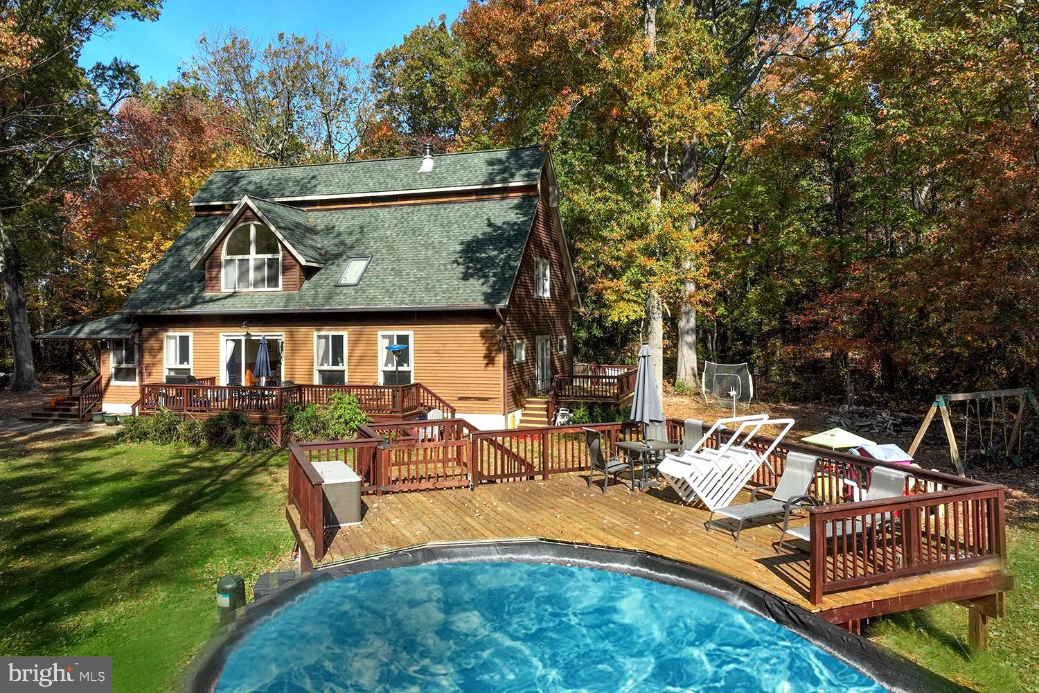 4921 Idlewilde Road Shady Side, MD 20764 - Photo 4 of 58 Beckoning Above-Ground Pool with Adjoining Deck