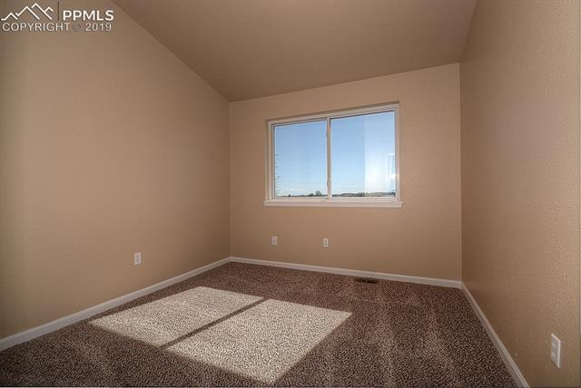 11625 Rex Road Peyton, CO 80831 - Photo 28 of 36 Main level bedroom
