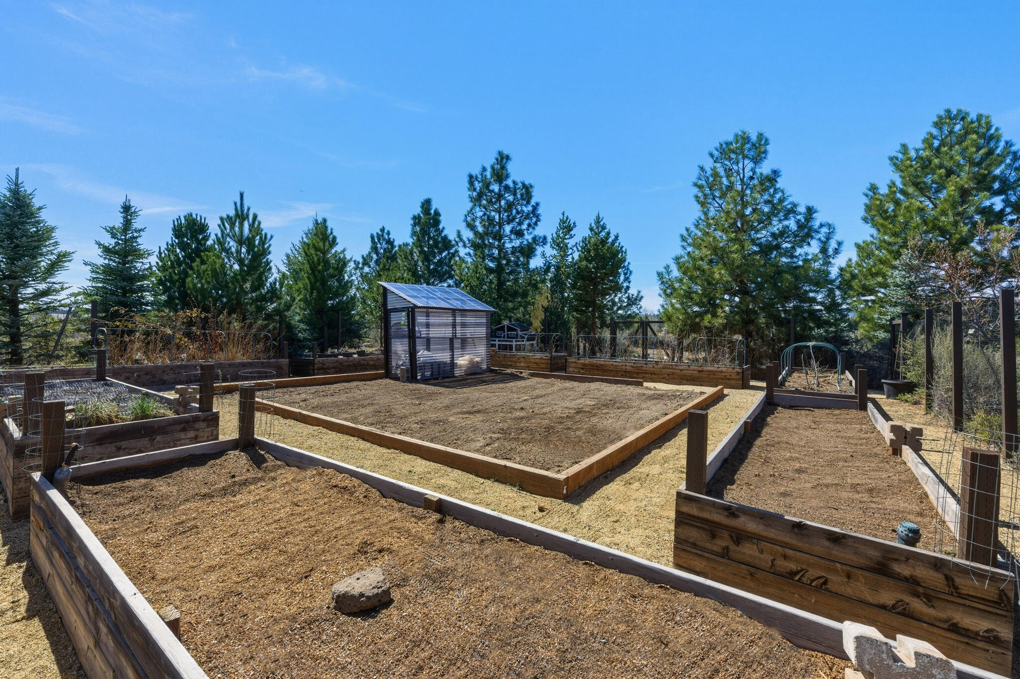 19100 Macalpine Loop Bend, OR 97702 - Photo 50 of 56 Raised garden beds in large fenced garden