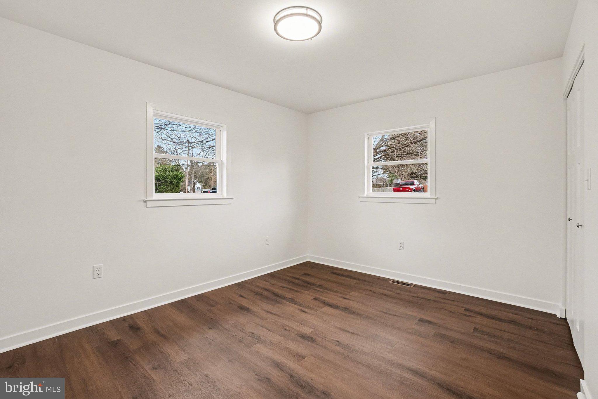 6216 Locust Street Harrisburg, PA 17112 - Photo 12 of 28 a view of a room with wooden floor and window