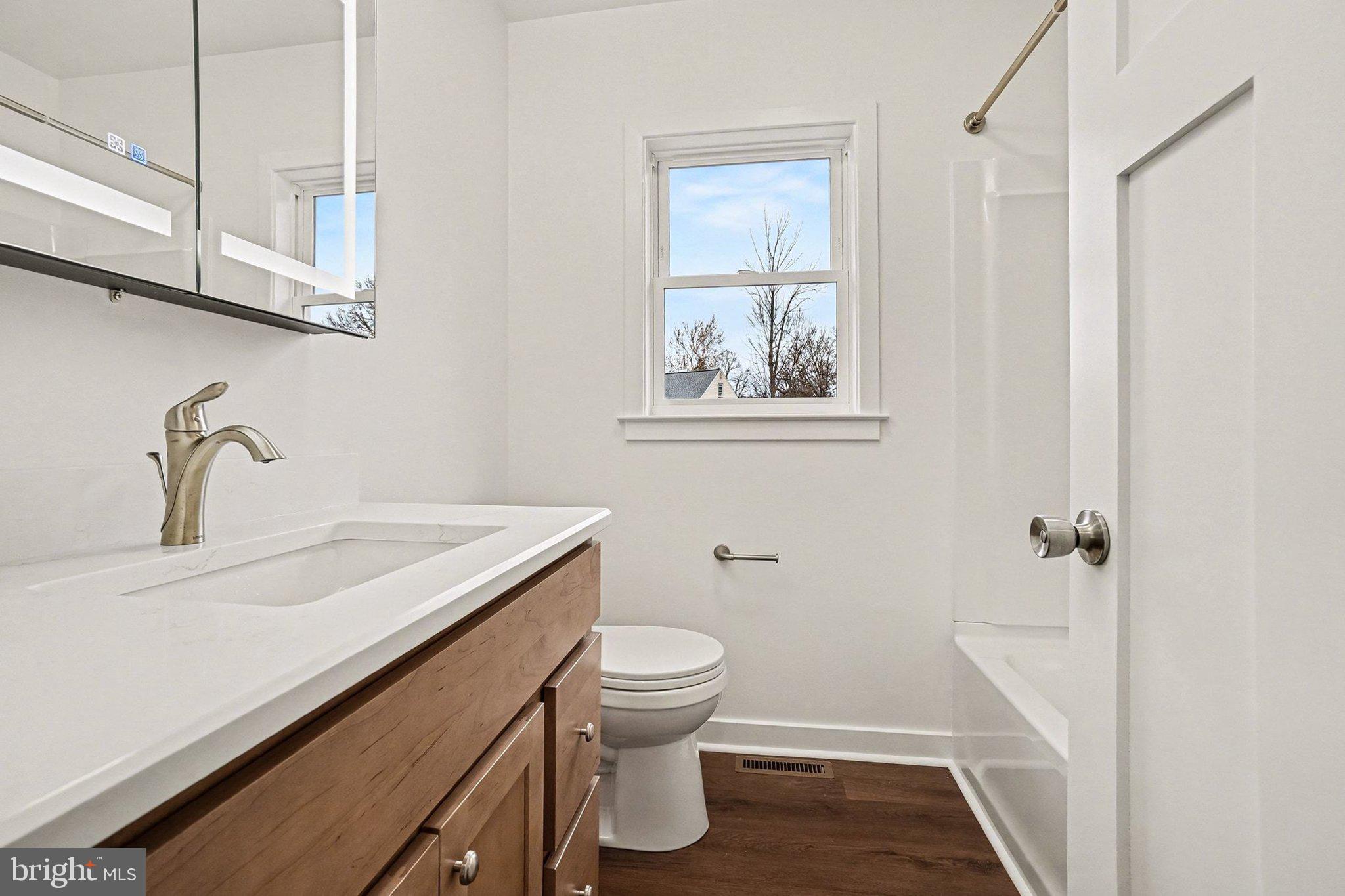 6216 Locust Street Harrisburg, PA 17112 - Photo 16 of 28 a bathroom with a sink a toilet and shower