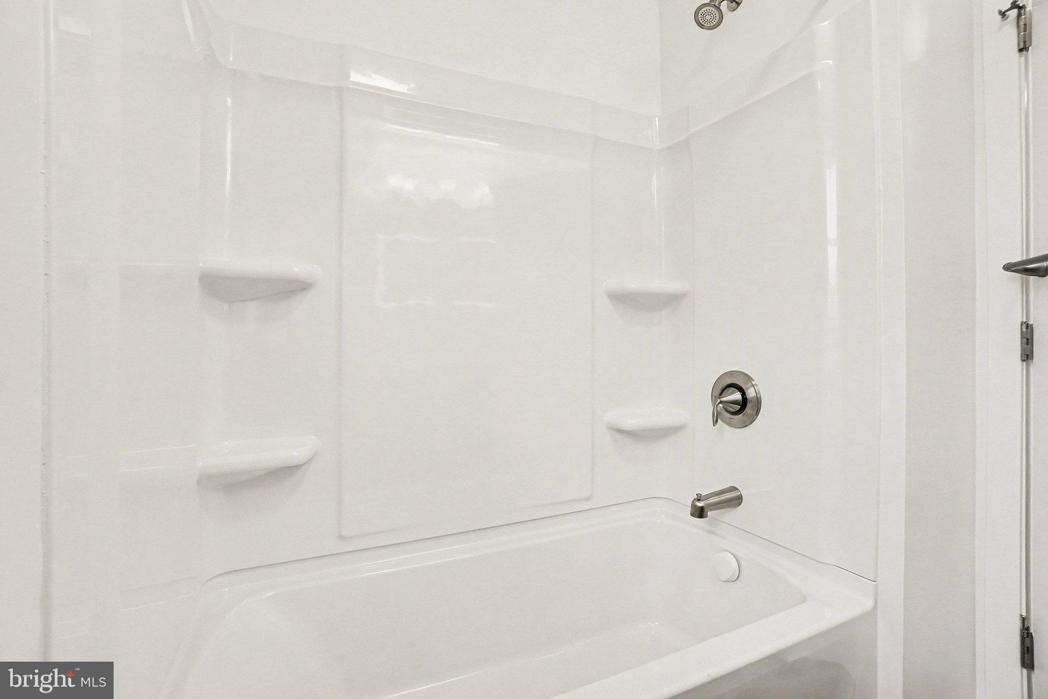 6216 Locust Street Harrisburg, PA 17112 - Photo 17 of 28 a bathroom with a bathtub