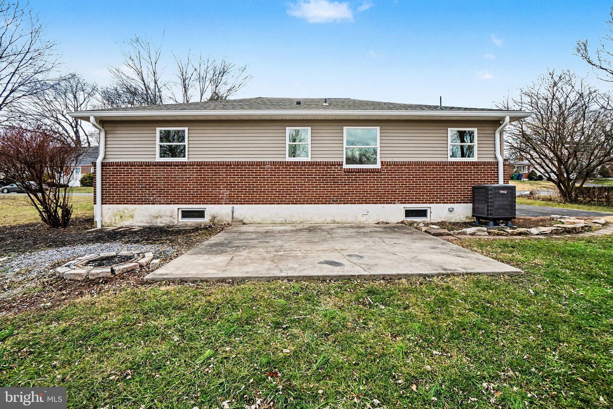 6216 Locust Street Harrisburg, PA 17112 - Photo 21 of 28 a backyard of a house with yard and outdoor seating