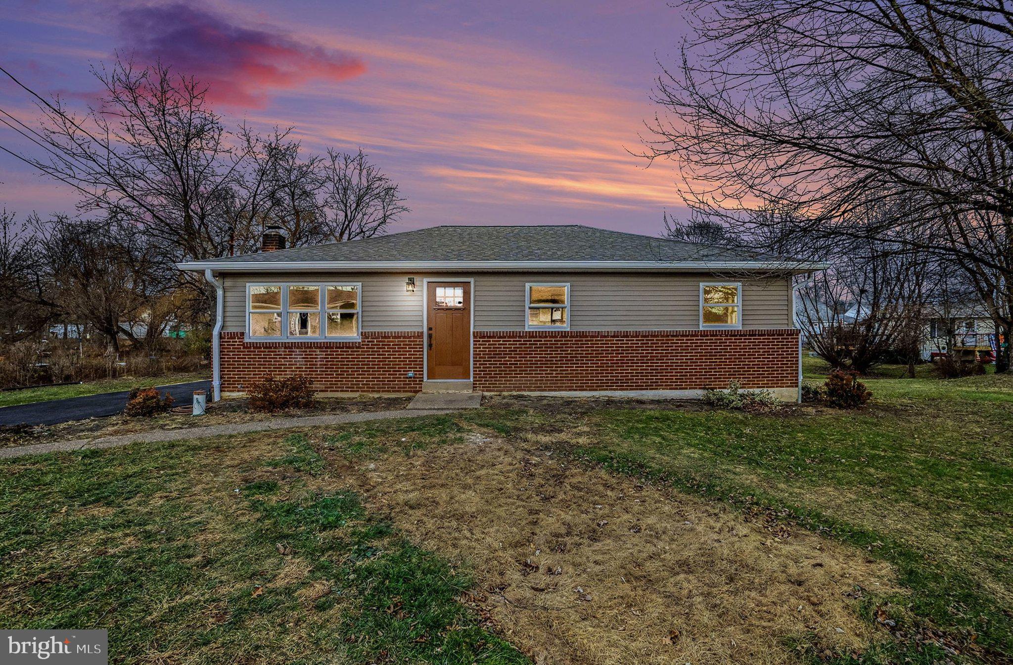 6216 Locust Street Harrisburg, PA 17112 - Photo 26 of 28 a view of a house with a yard