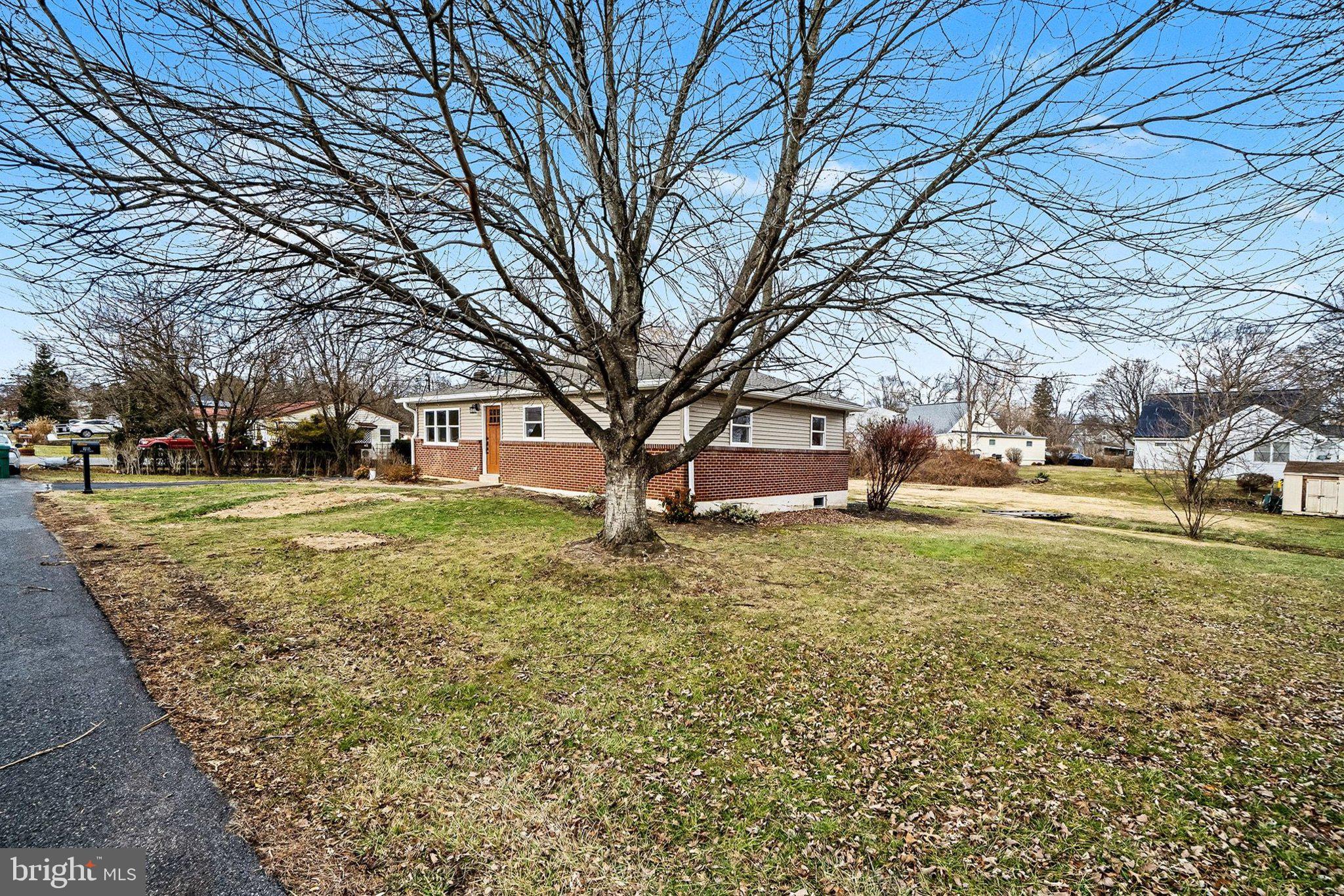 6216 Locust Street Harrisburg, PA 17112 - Photo 27 of 28 a view of a house with a yard