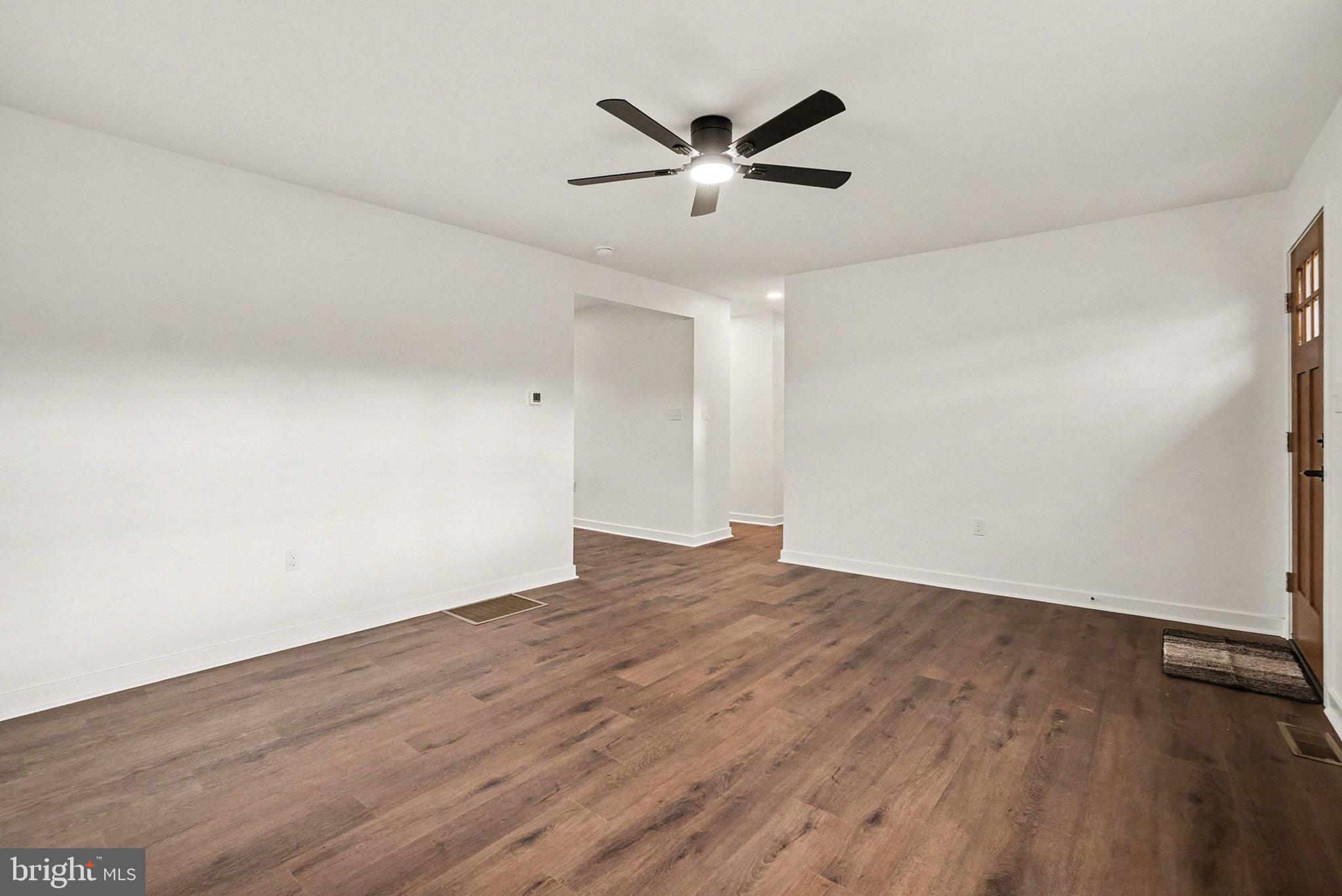 6216 Locust Street Harrisburg, PA 17112 - Photo 3 of 28 wooden floor in an empty room