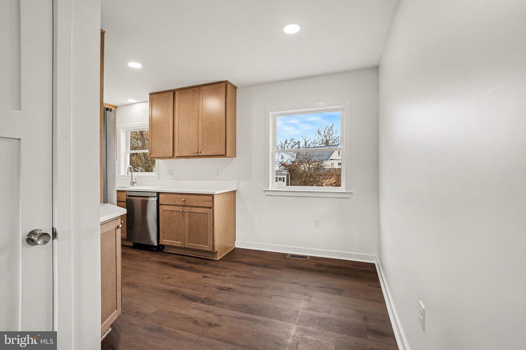 6216 Locust Street Harrisburg, PA 17112 - Photo 5 of 28 a view of cabinets with wooden floor and window