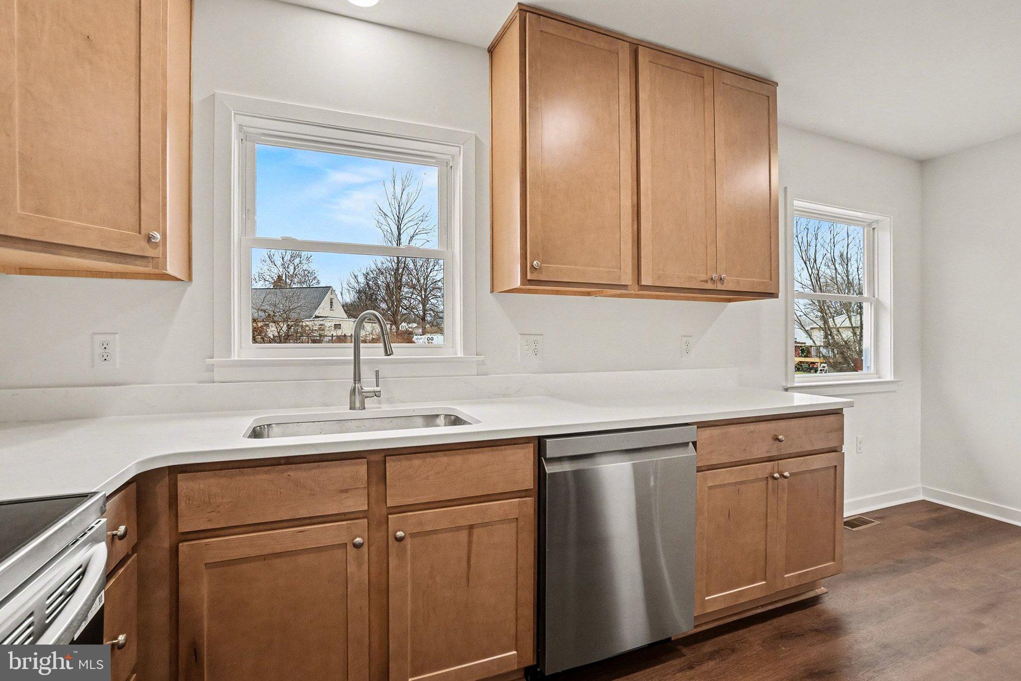 6216 Locust Street Harrisburg, PA 17112 - Photo 8 of 28 a kitchen with a sink cabinets and window