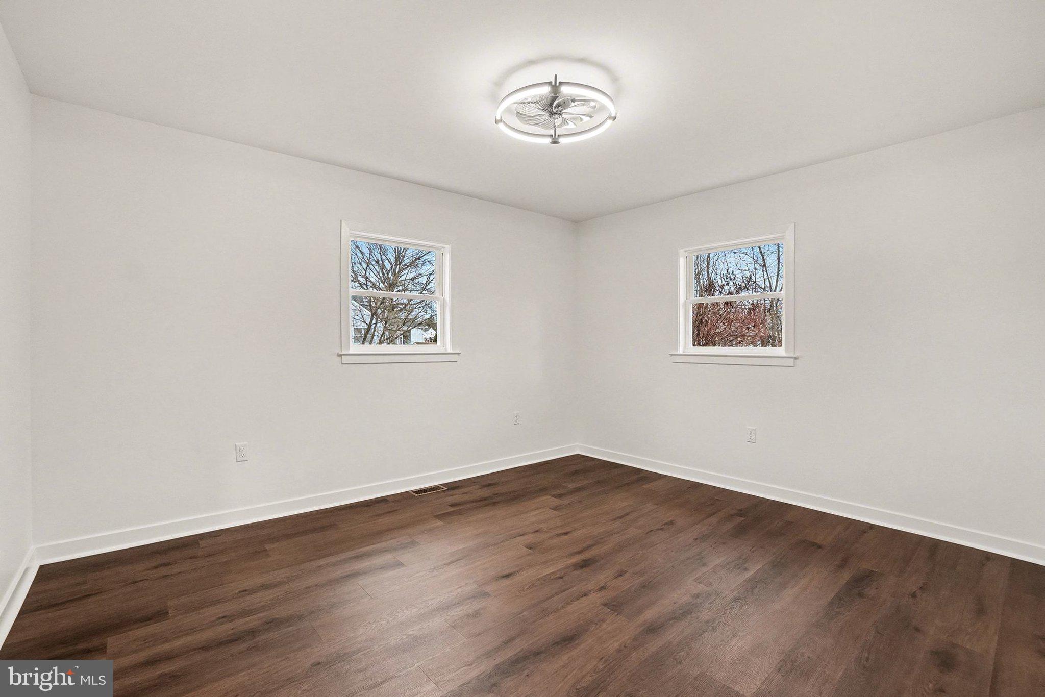 6216 Locust Street Harrisburg, PA 17112 - Photo 9 of 28 a view of a room with wooden floor and window