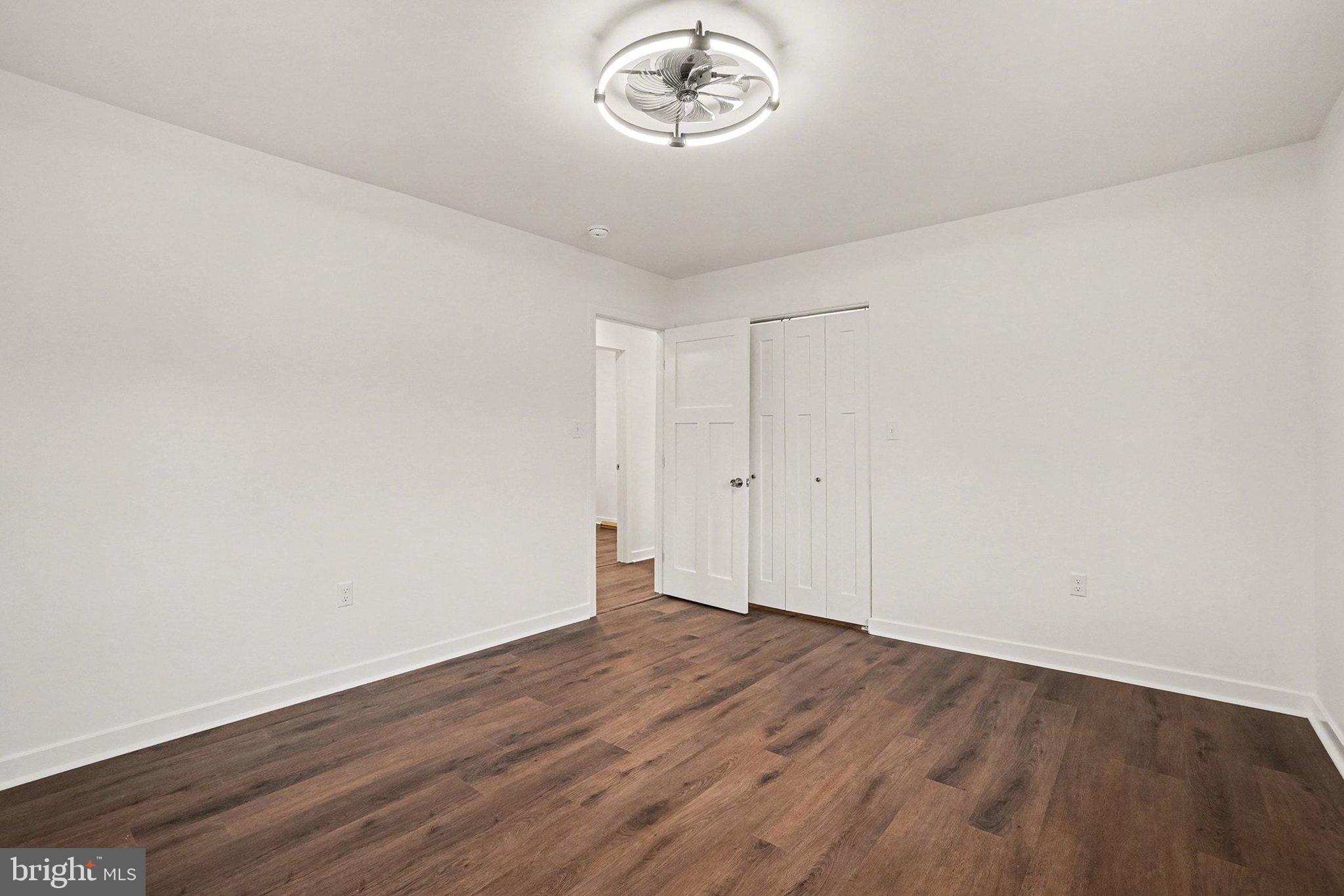 6216 Locust Street Harrisburg, PA 17112 - Photo 10 of 28 a view of a room with wooden floor and window