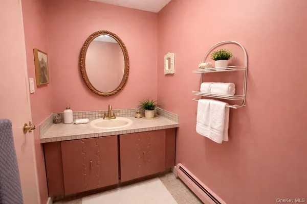 a bathroom with a sink and a mirror
