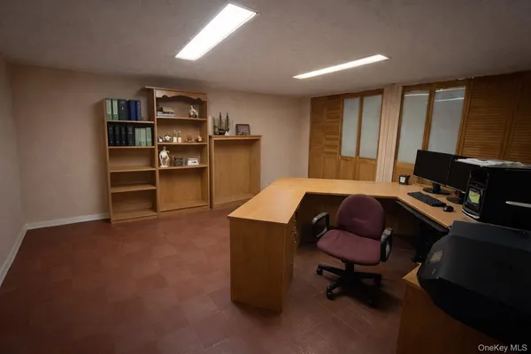 a workspace with furniture and window