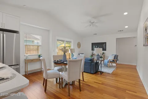 an aerial view of residential houses with outdoor space and swimming pool