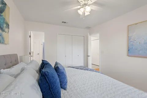 an empty room with a window and wooden floor