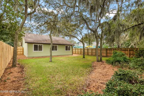 a view of backyard with green space