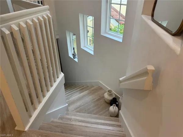 a view of a living room with wooden floor