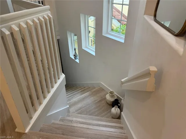 a view of a living room with wooden floor