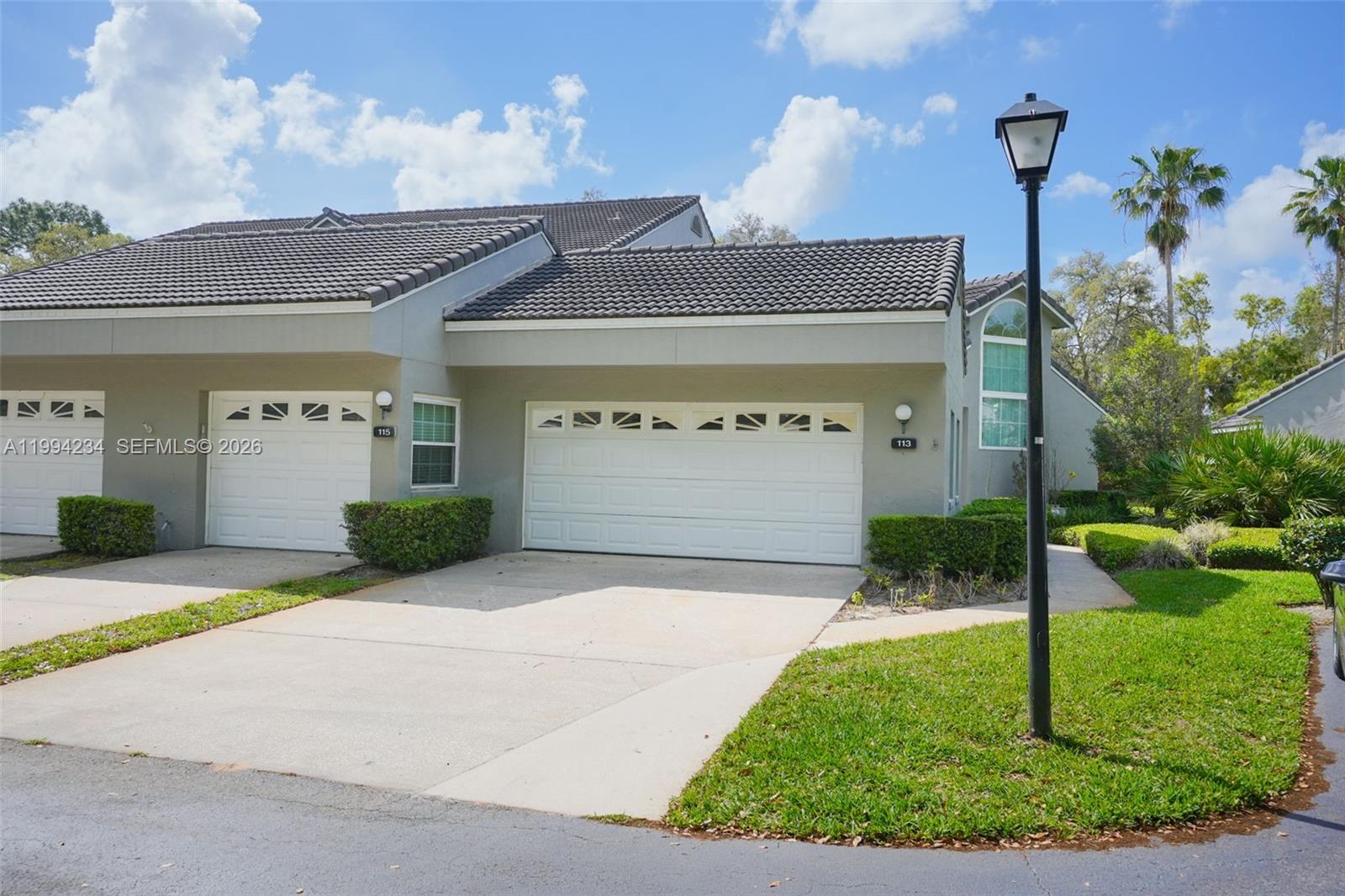113 Durham Place Longwood, FL 32779 - Photo 1 of 56 a front view of a house with a yard and garage