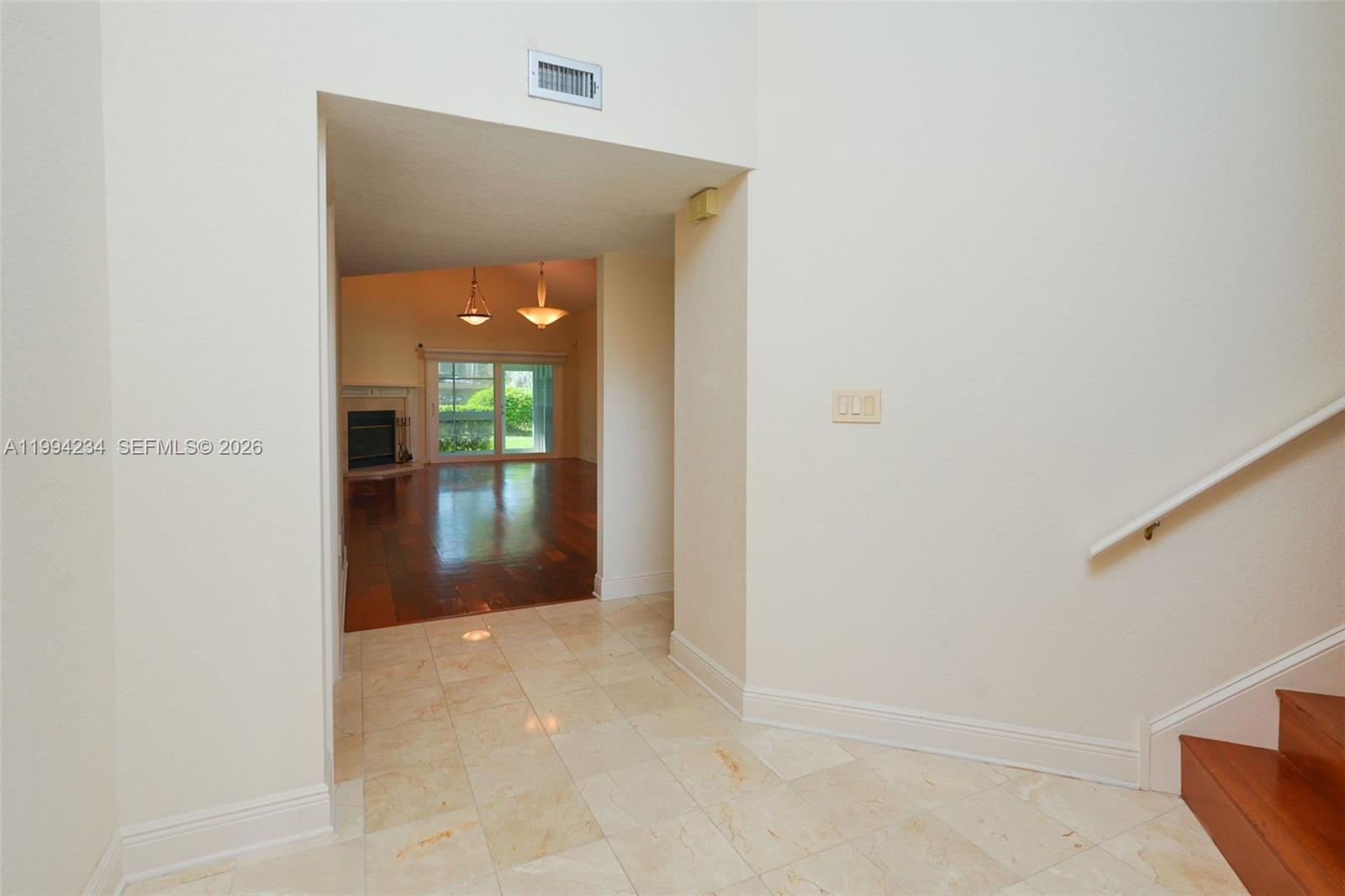 113 Durham Place Longwood, FL 32779 - Photo 12 of 56 a view of a hallway with wooden floor and a bathroom