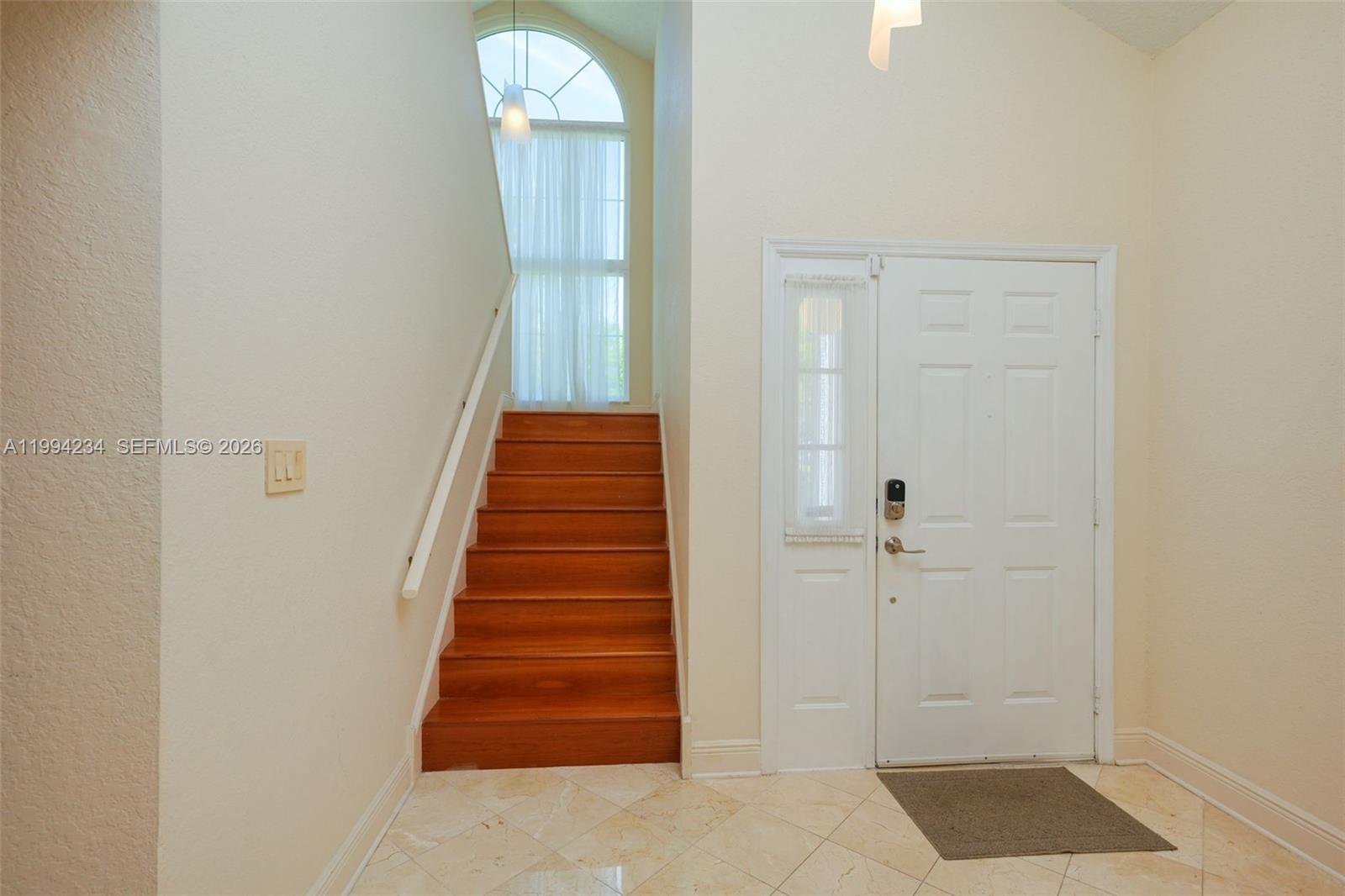 113 Durham Place Longwood, FL 32779 - Photo 13 of 56 a view of a hallway with entryway and wooden floor