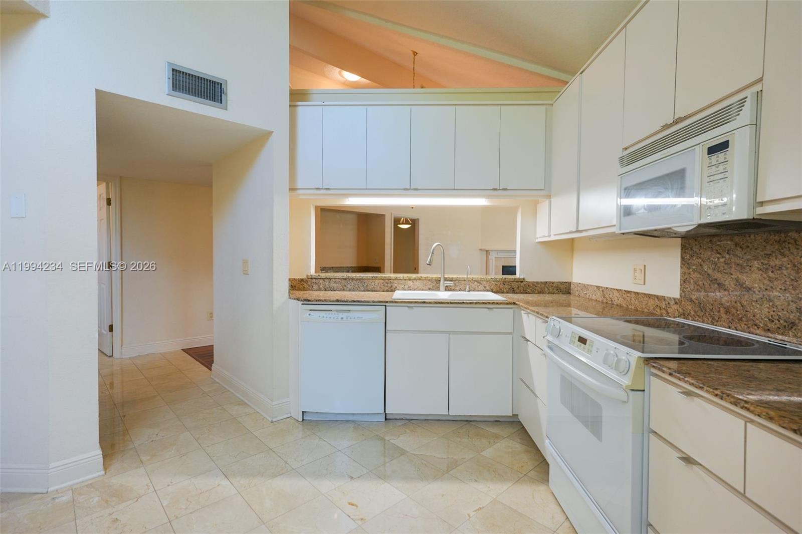 113 Durham Place Longwood, FL 32779 - Photo 21 of 56 a kitchen with cabinets and sink
