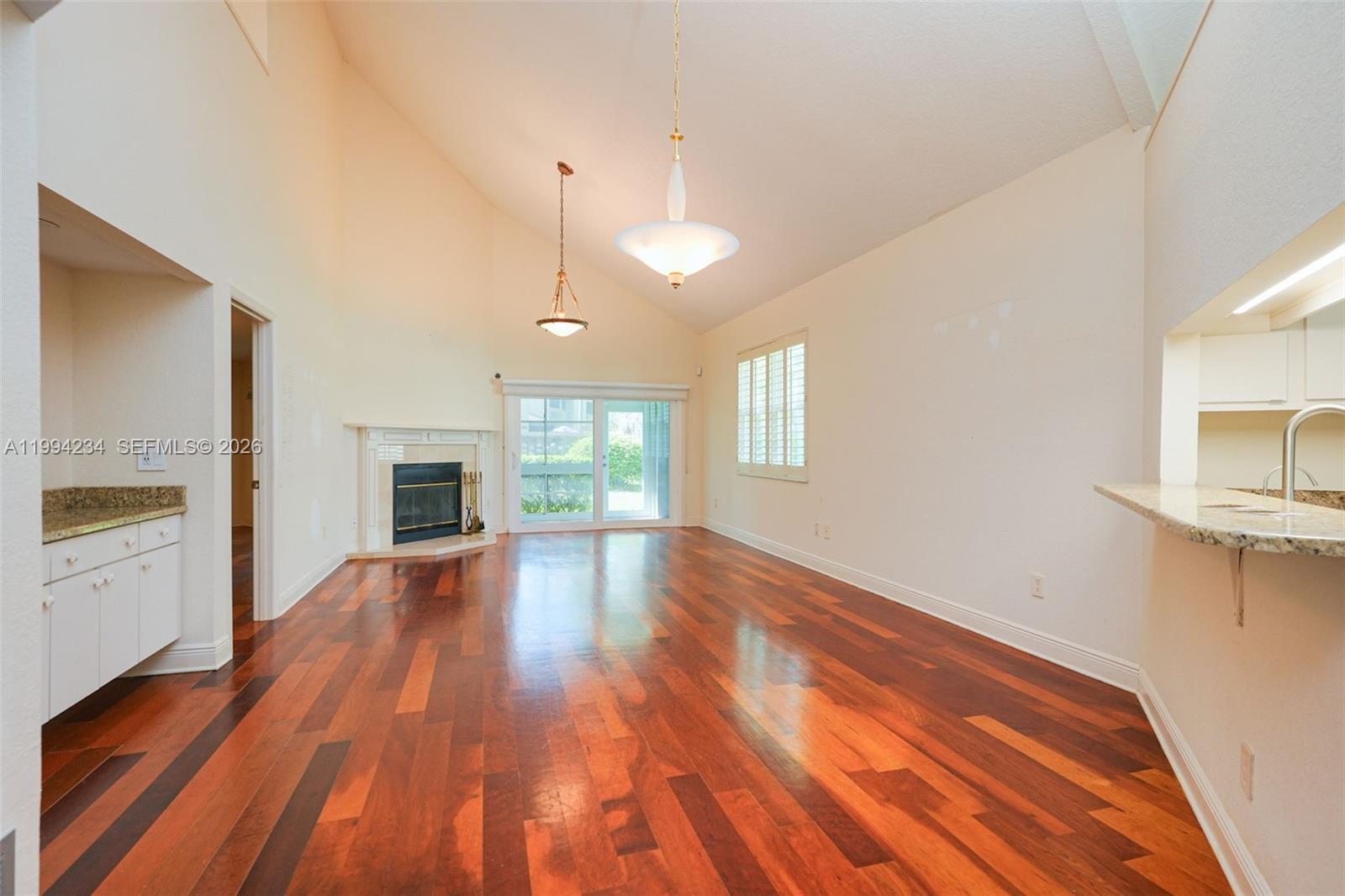 113 Durham Place Longwood, FL 32779 - Photo 23 of 56 a view of an empty room with wooden floor and a window