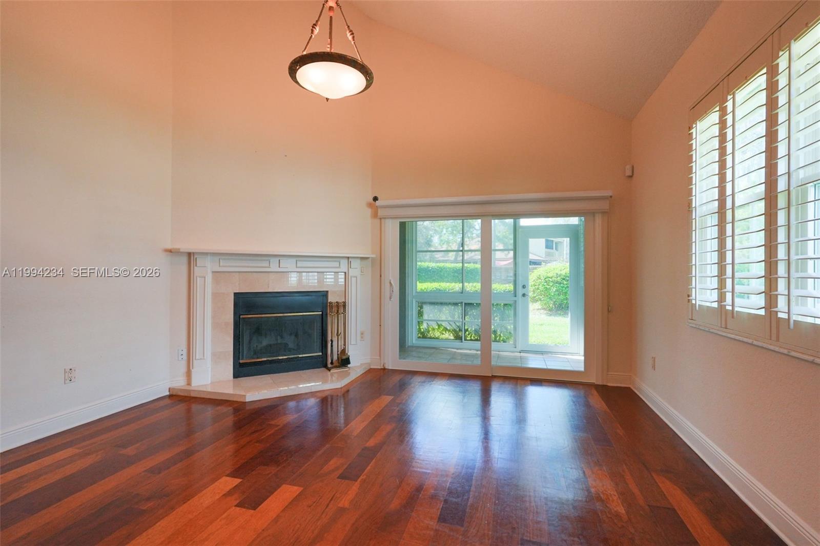 113 Durham Place Longwood, FL 32779 - Photo 25 of 56 a view of an empty room with wooden floor and a window