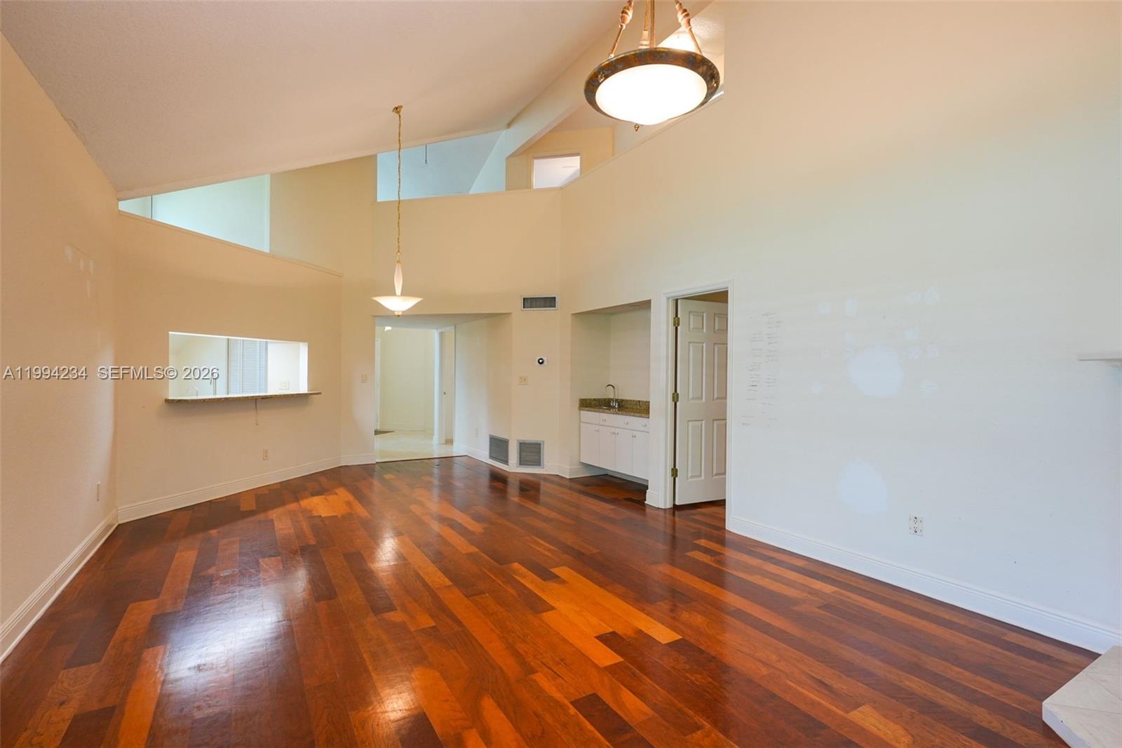 113 Durham Place Longwood, FL 32779 - Photo 26 of 56 a view of an empty room with wooden floor and window