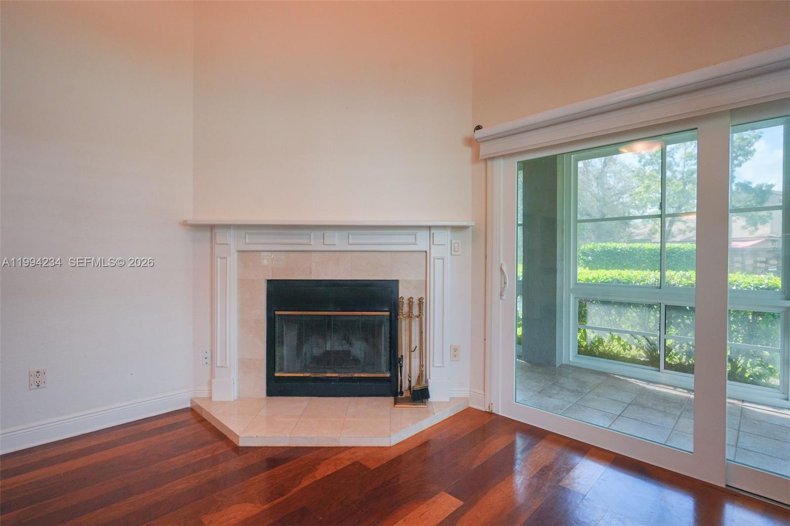 113 Durham Place Longwood, FL 32779 - Photo 28 of 56 a view of an empty room with wooden floor and a window