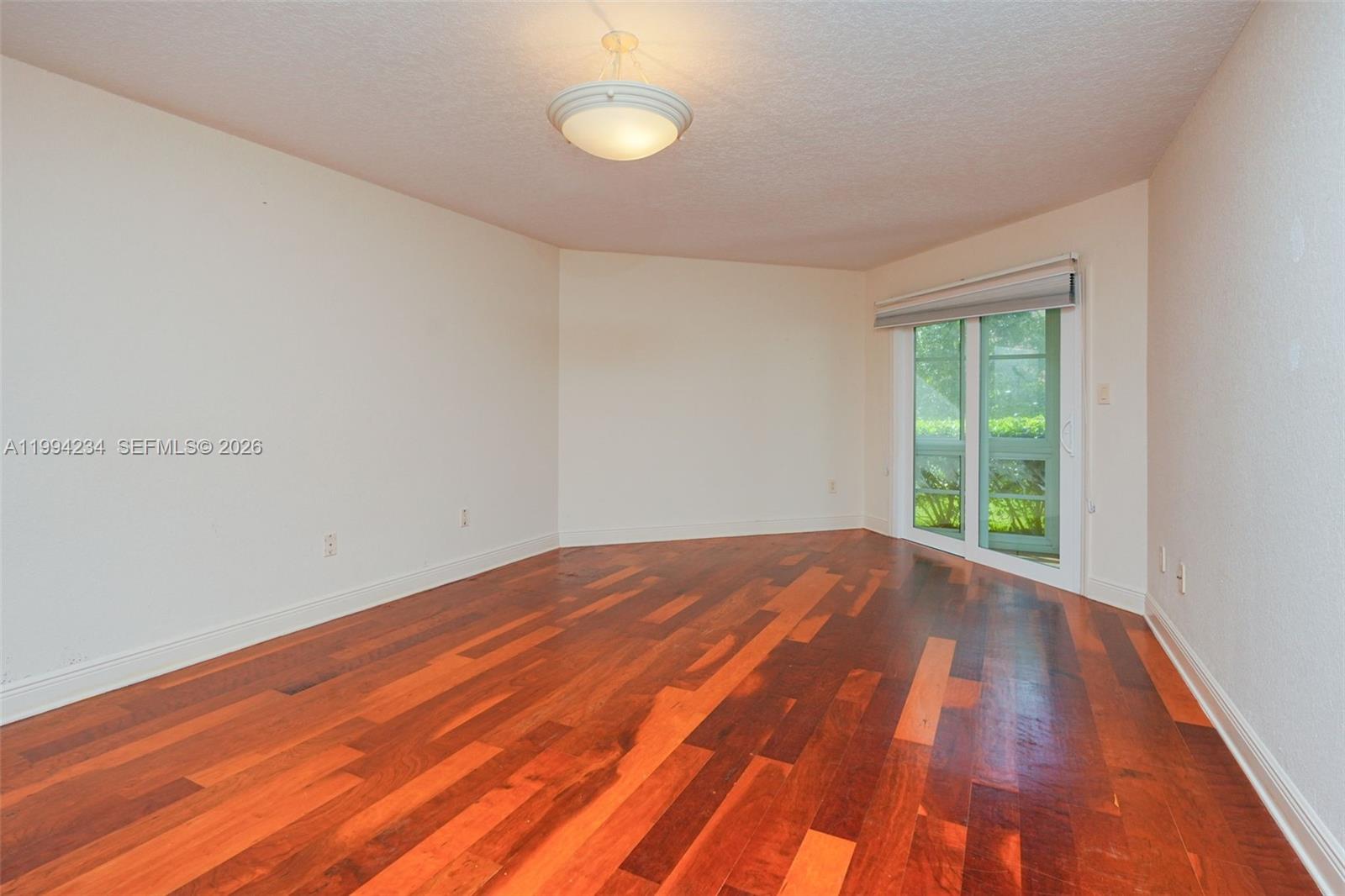 113 Durham Place Longwood, FL 32779 - Photo 29 of 56 a view of an empty room with wooden floor and a window