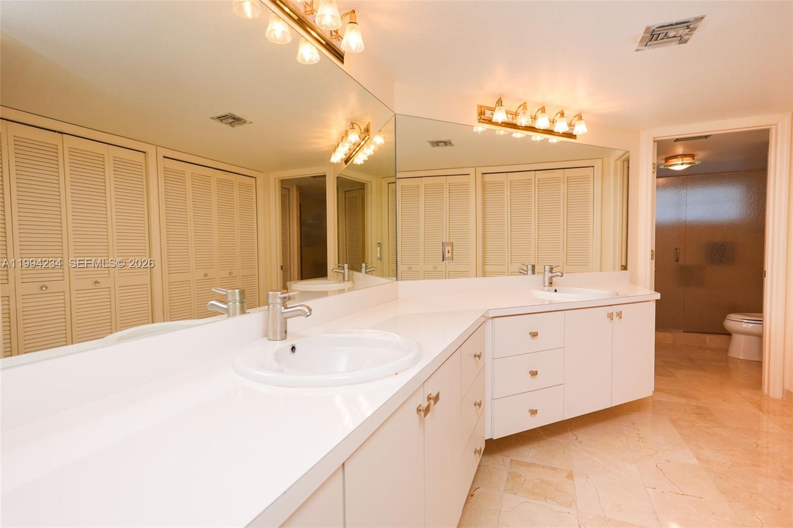 113 Durham Place Longwood, FL 32779 - Photo 31 of 56 a bathroom with 2 sink tub and a mirror