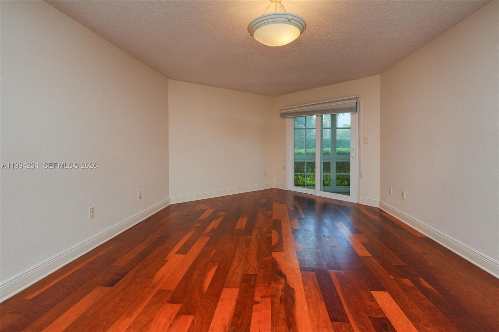 113 Durham Place Longwood, FL 32779 - Photo 41 of 56 a view of an empty room with wooden floor and a window