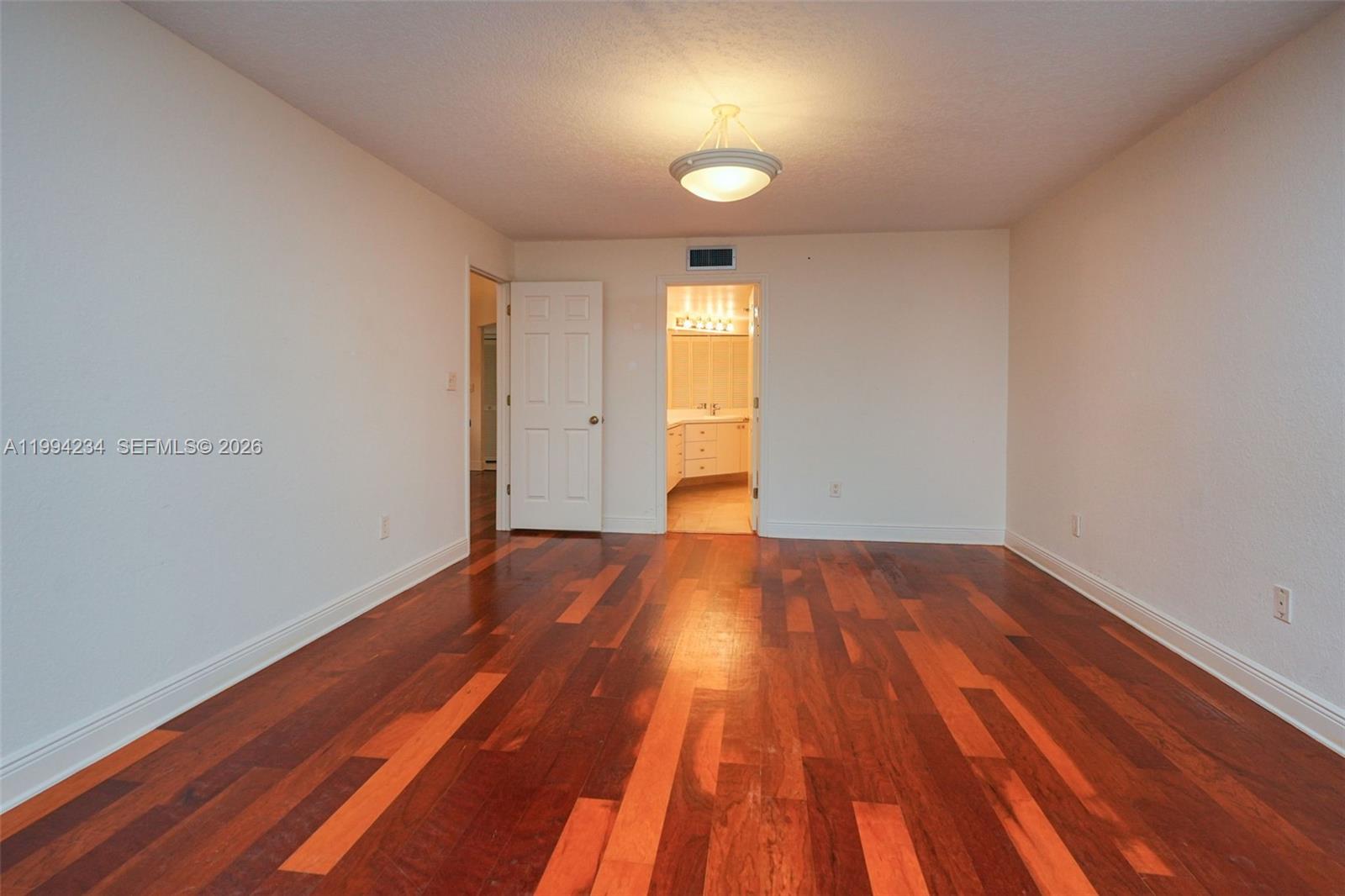 113 Durham Place Longwood, FL 32779 - Photo 42 of 56 a view of empty room with wooden floor and fan