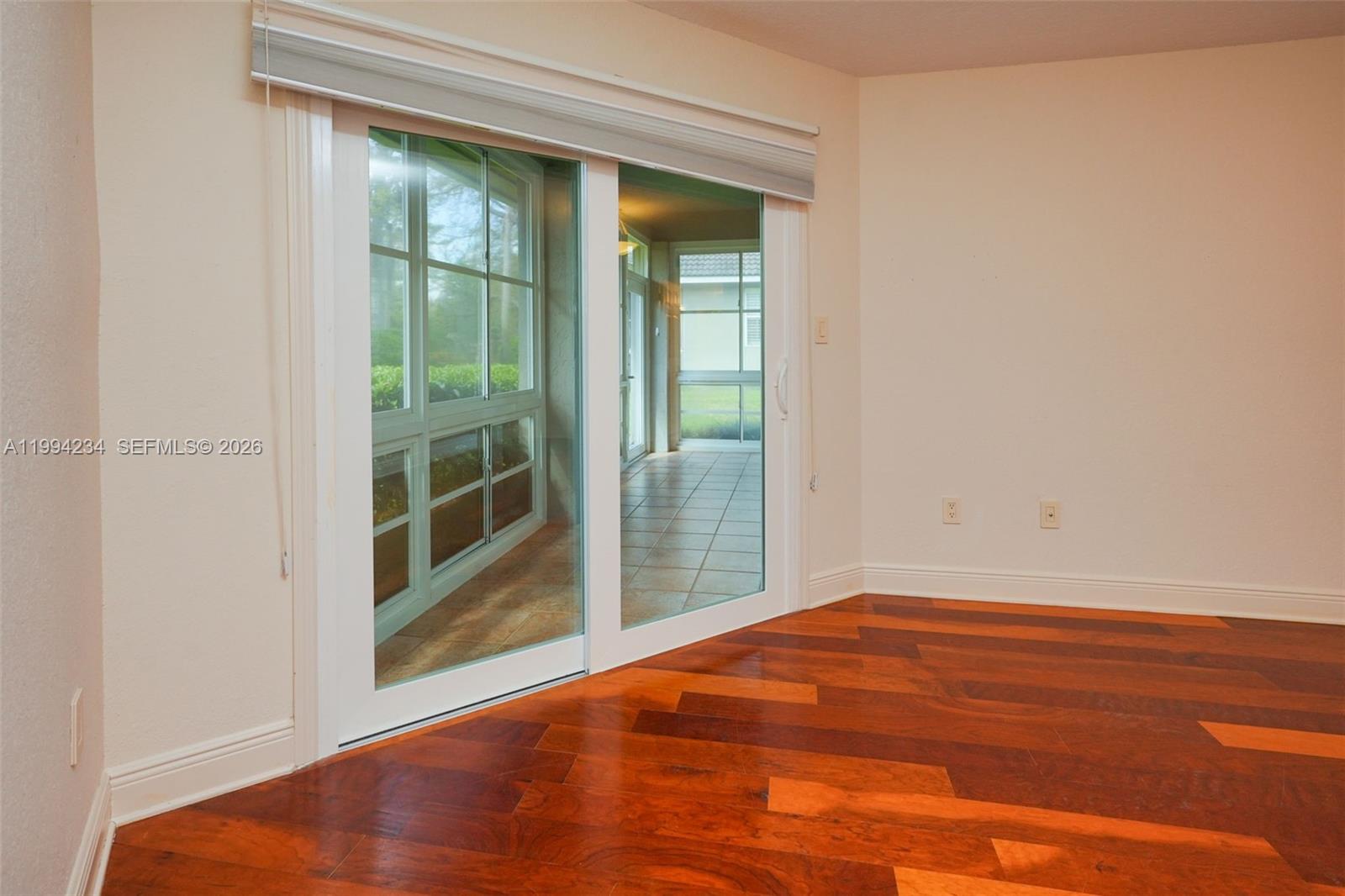 113 Durham Place Longwood, FL 32779 - Photo 44 of 56 an empty room with wooden floor and windows