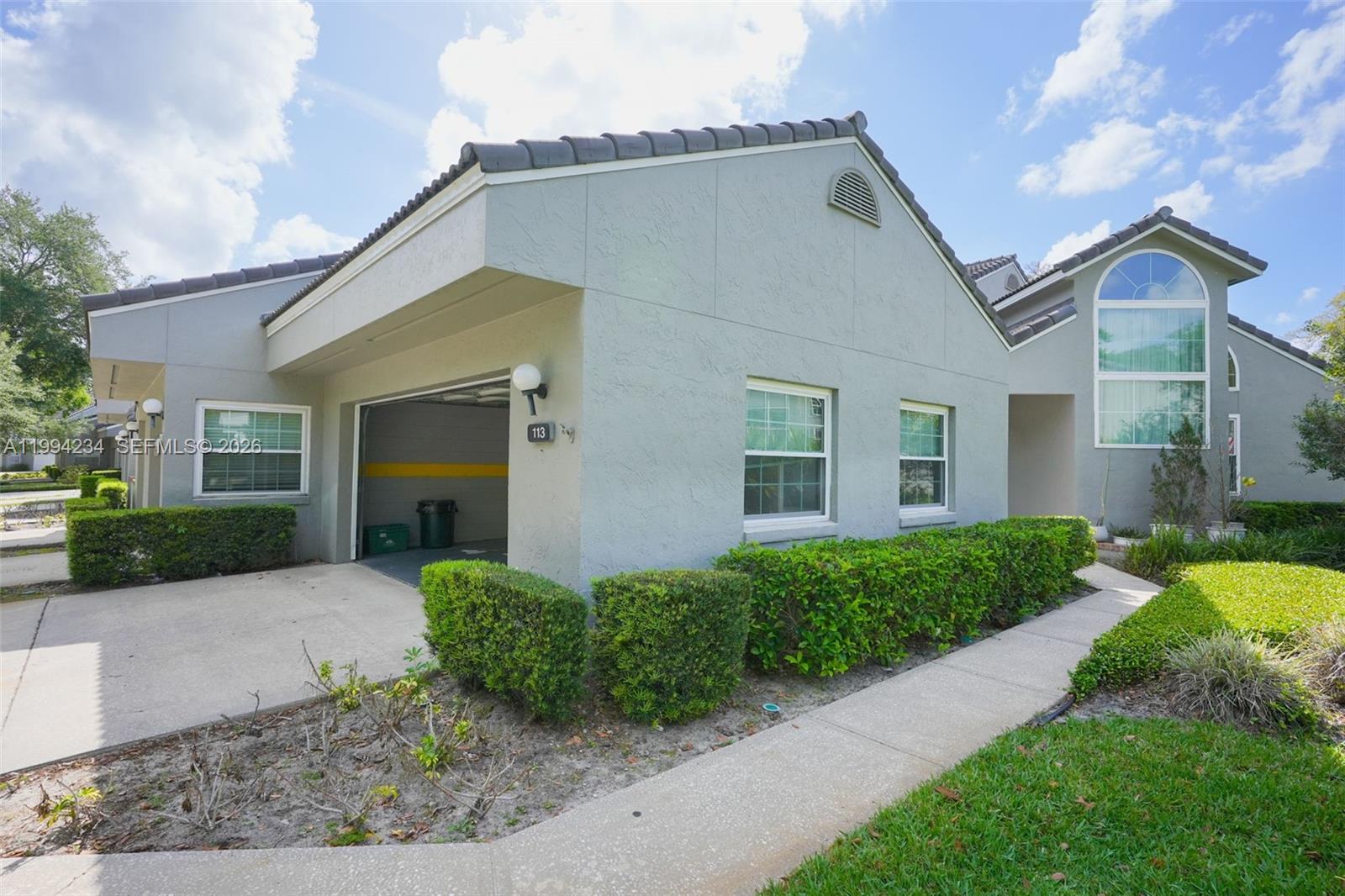 113 Durham Place Longwood, FL 32779 - Photo 5 of 56 a view of a house with a yard and plants