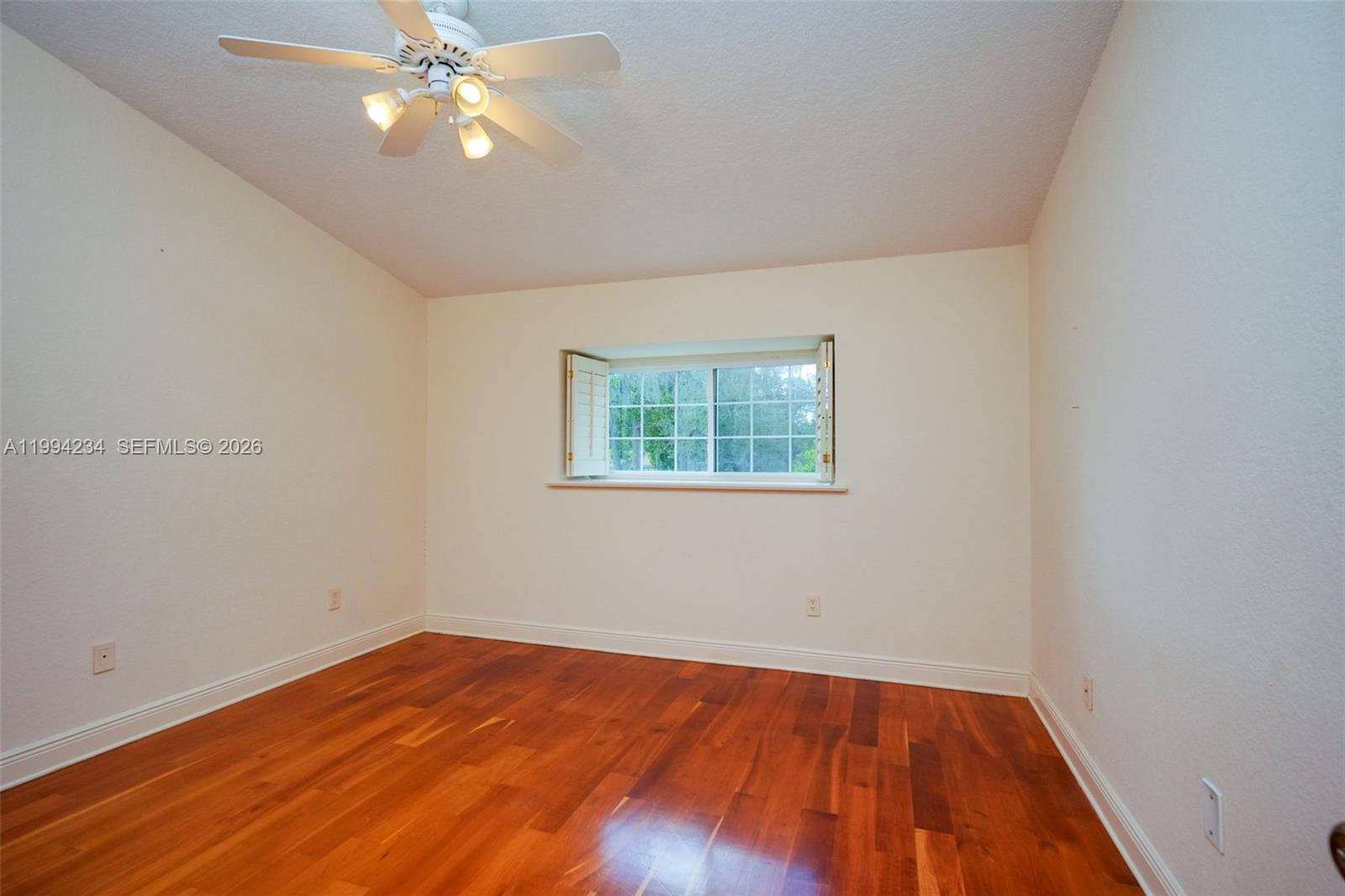 113 Durham Place Longwood, FL 32779 - Photo 51 of 56 wooden floor in an empty room with a window