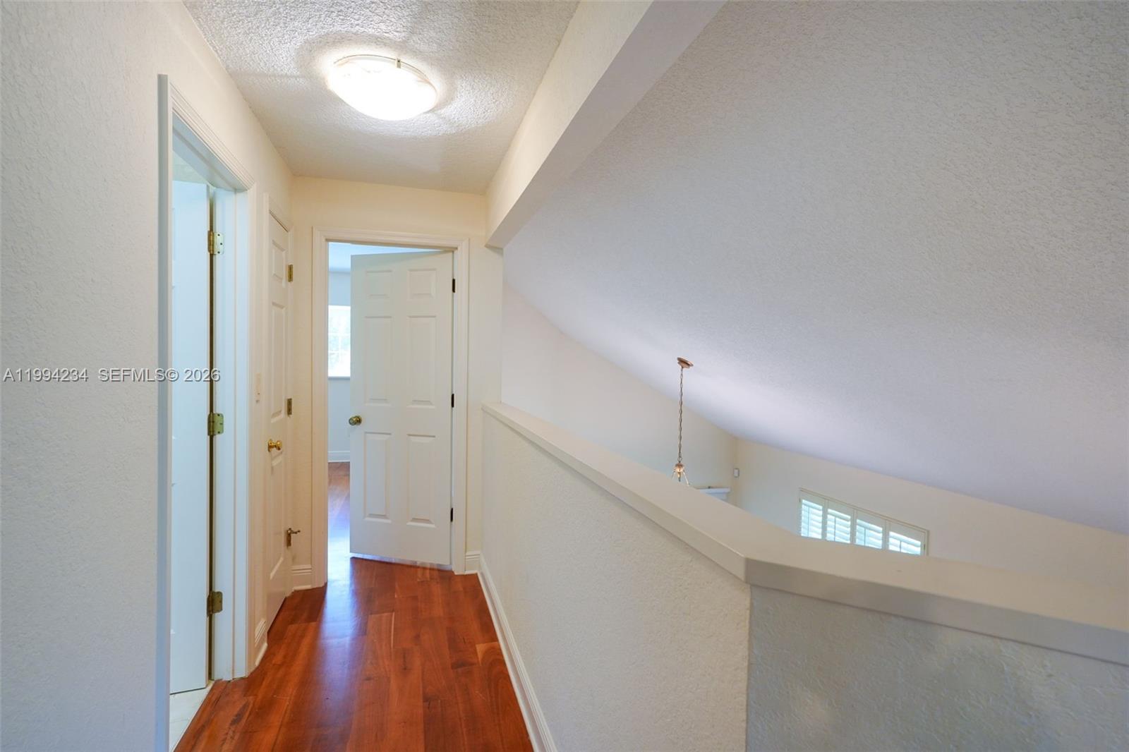 113 Durham Place Longwood, FL 32779 - Photo 55 of 56 a view of hallway with stairs and wooden floor