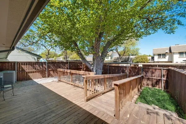 a view of a wooden deck with a patio